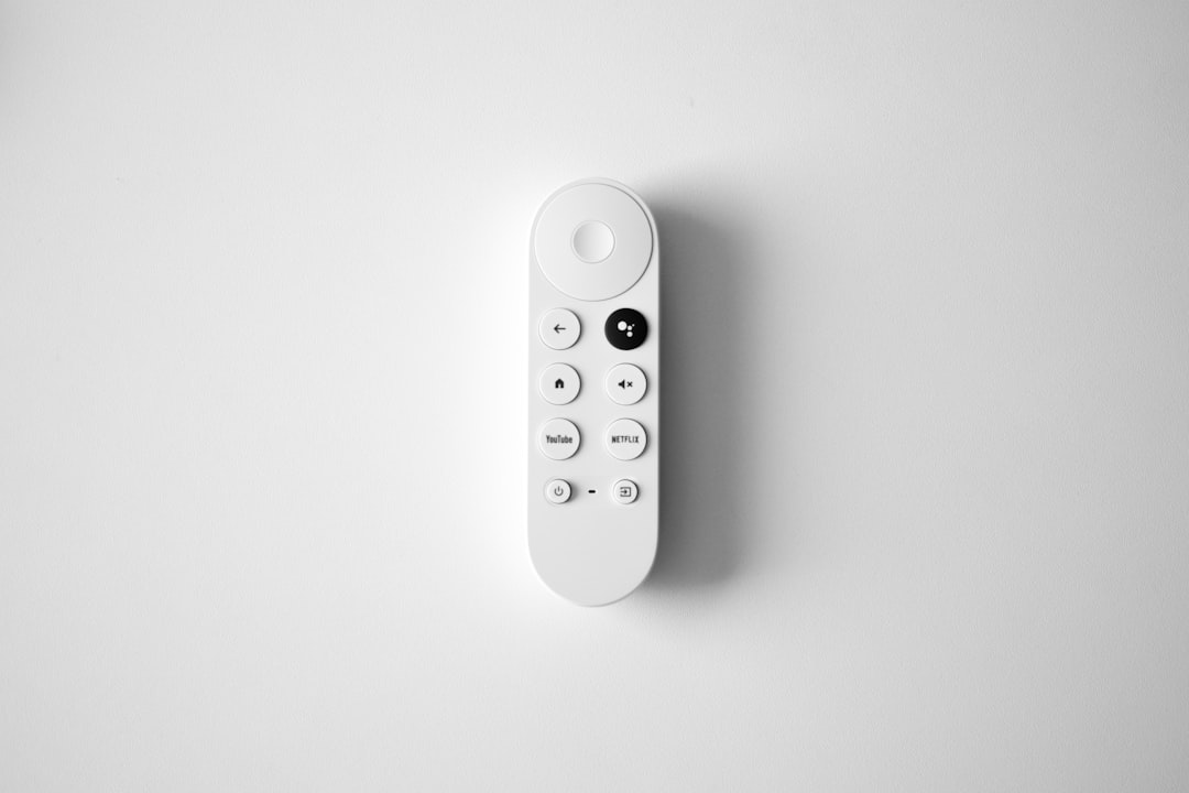 The Google Chromecast with Google TV. by TV Brands a white remote control
