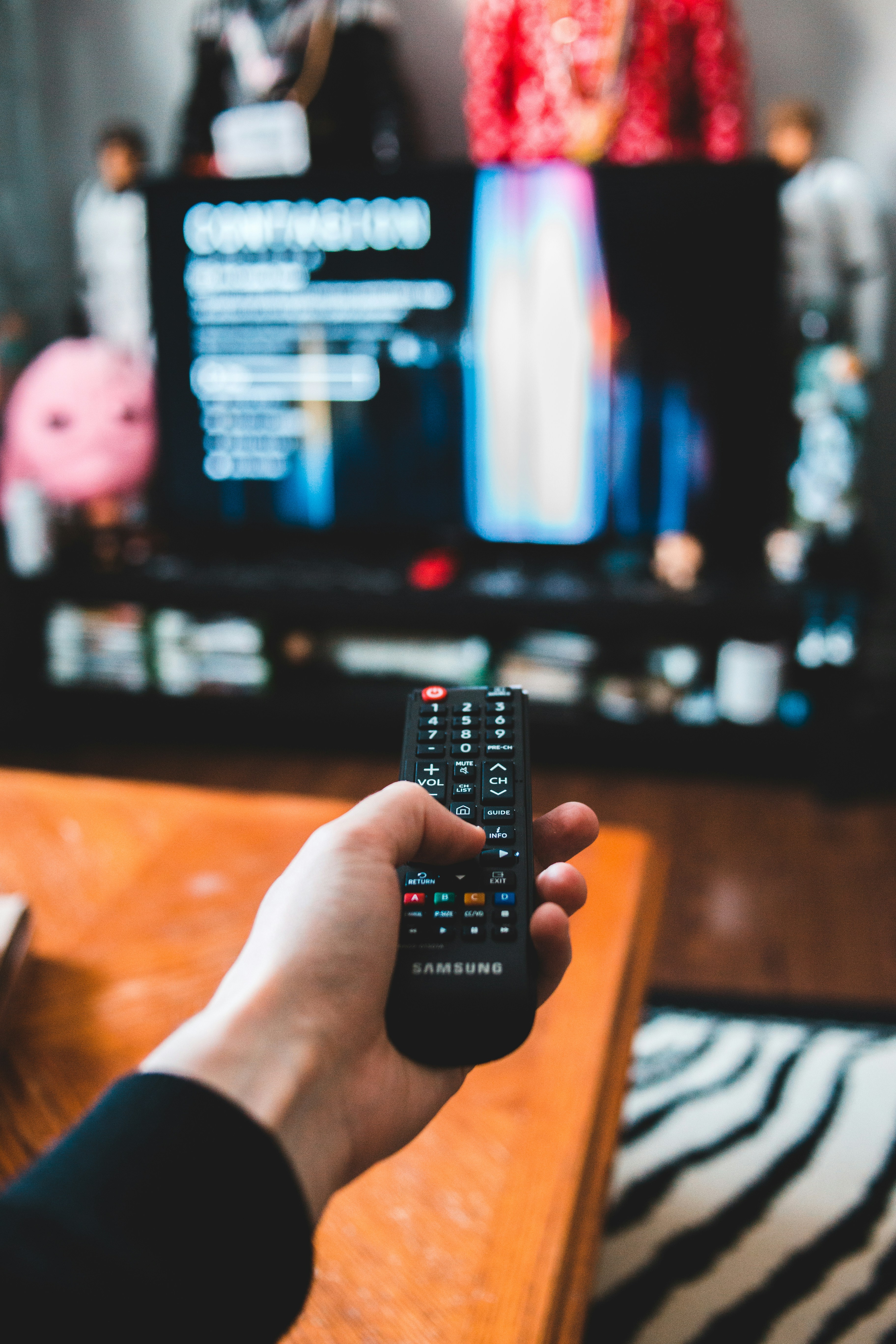 🏁 Conclusion: Picking Your Perfect TV Brand in 2024 by TV Brands person holding black remote control