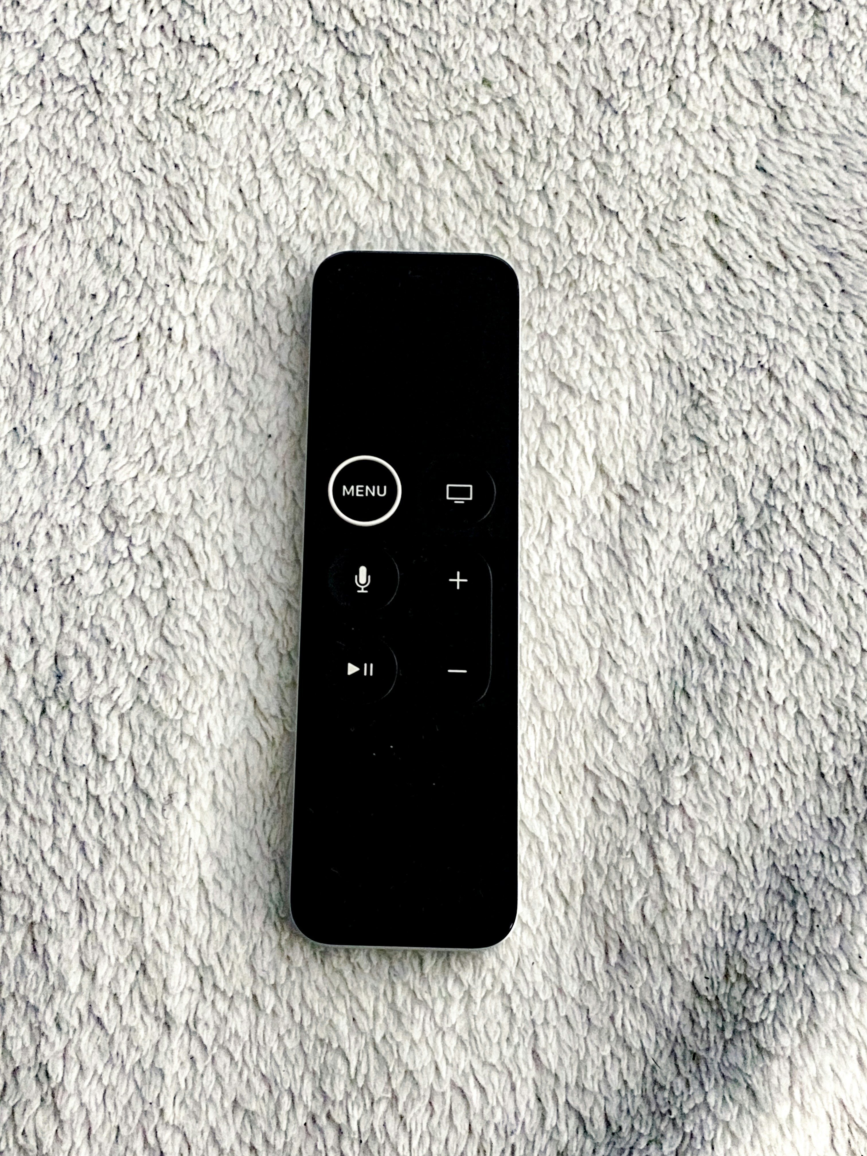 ❓ FAQ: Your Smart TV Questions Answered by TV Brands black remote control on white textile