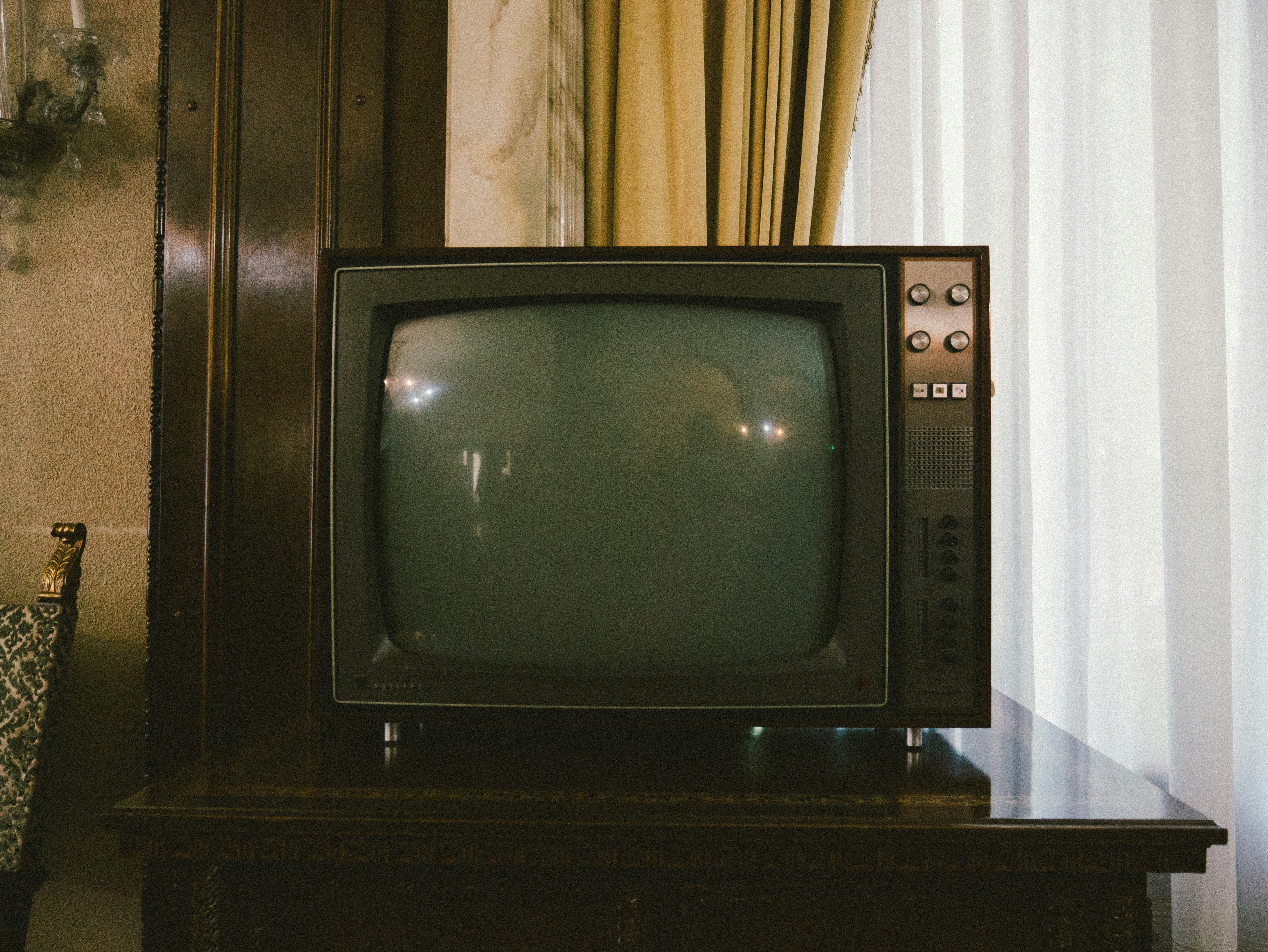 Vintage TV in Romania. by TV Brands turned-off gray CRT TV on table
