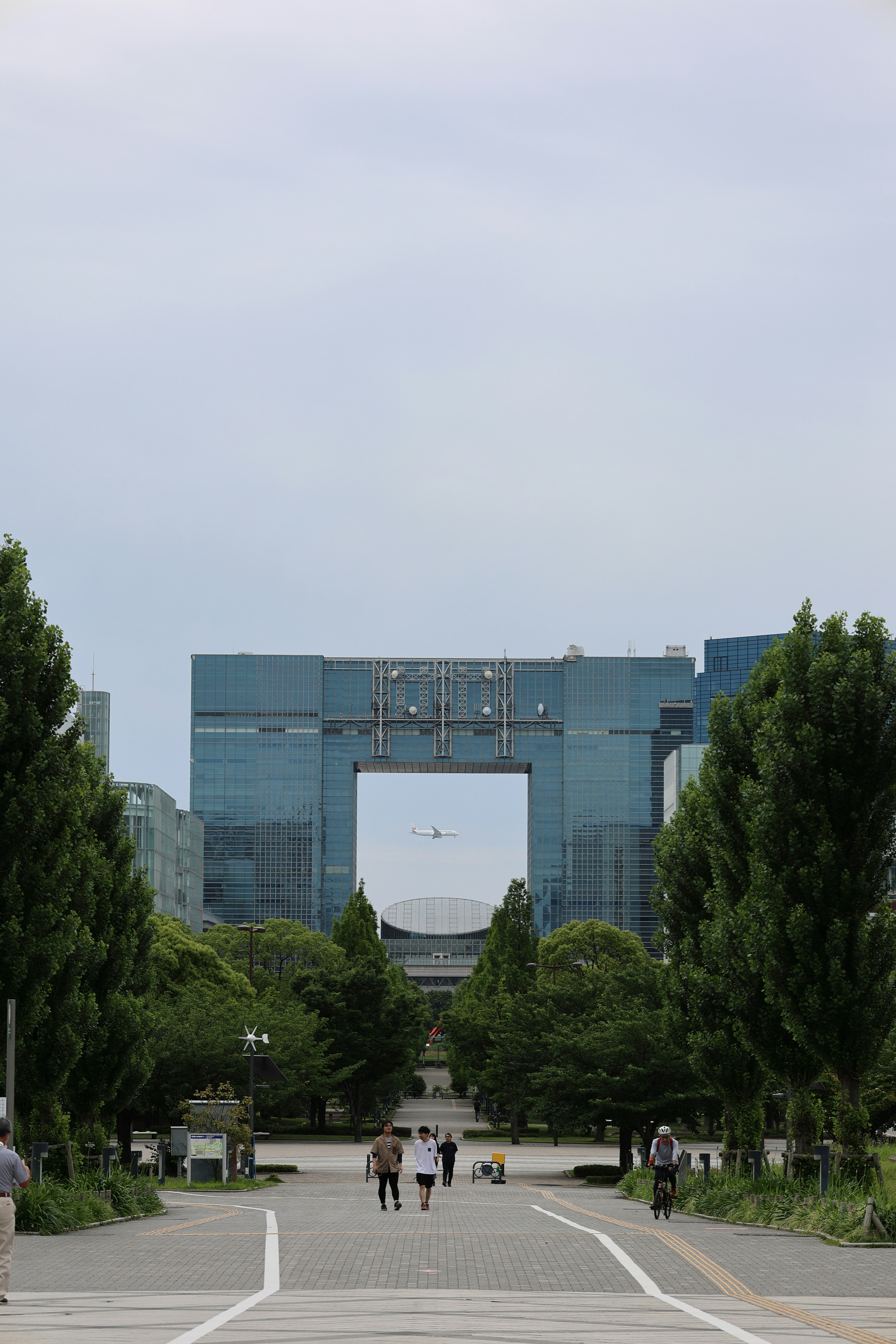 A couple of people walking down a street