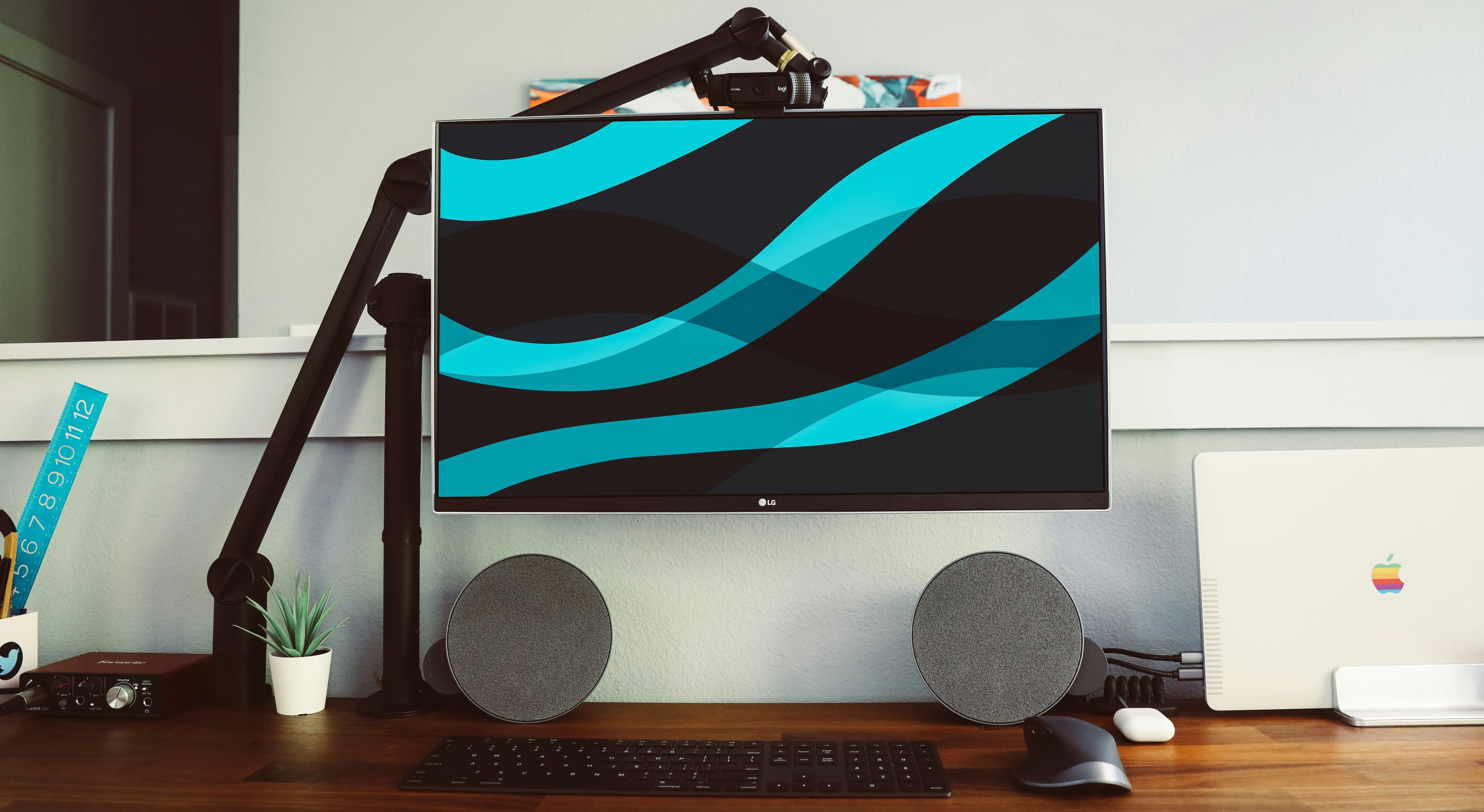 Minimal Desk Setup by TV Brands flat screen monitor beside wall and pair of gray speakers