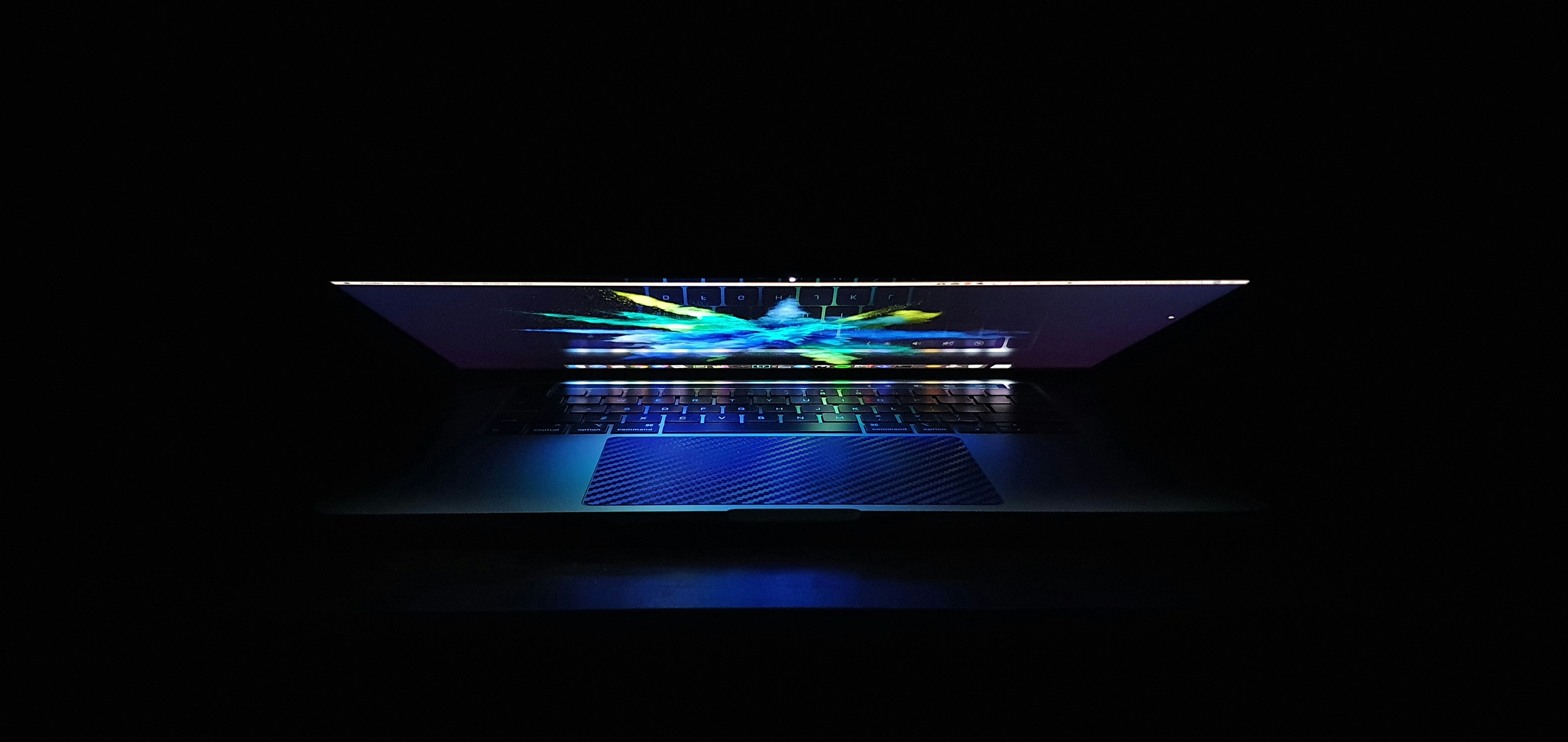 blue and white lights on black surface