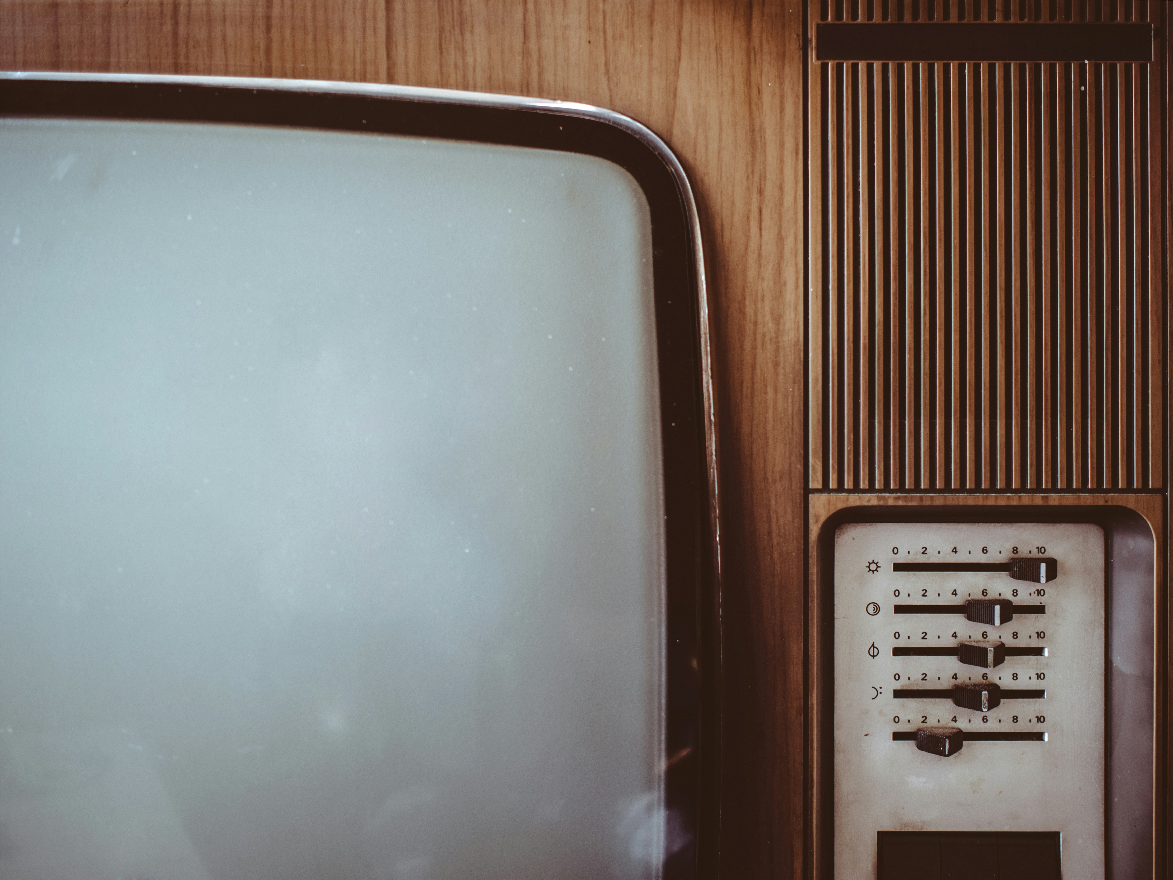 ❓ FAQ: Your Burning Questions About TV Lifespan Answered by TV Brands an old fashioned television set with a white screen