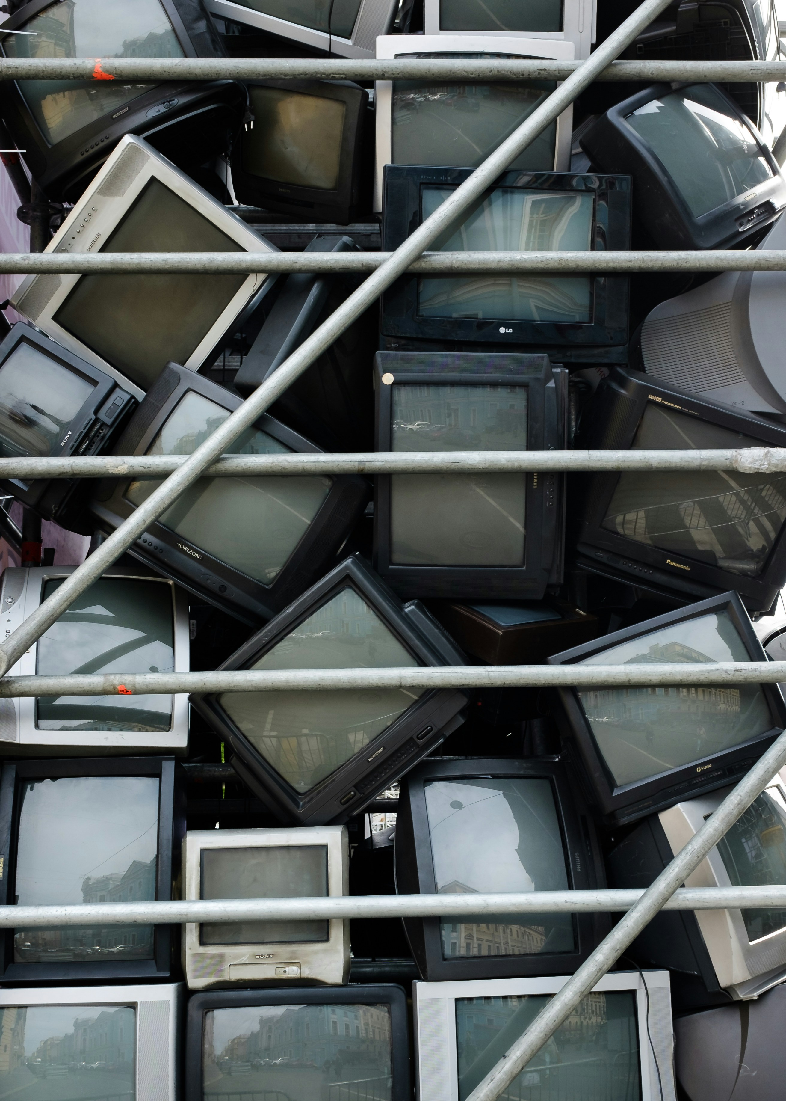 a pile of televisions sitting on top of each other