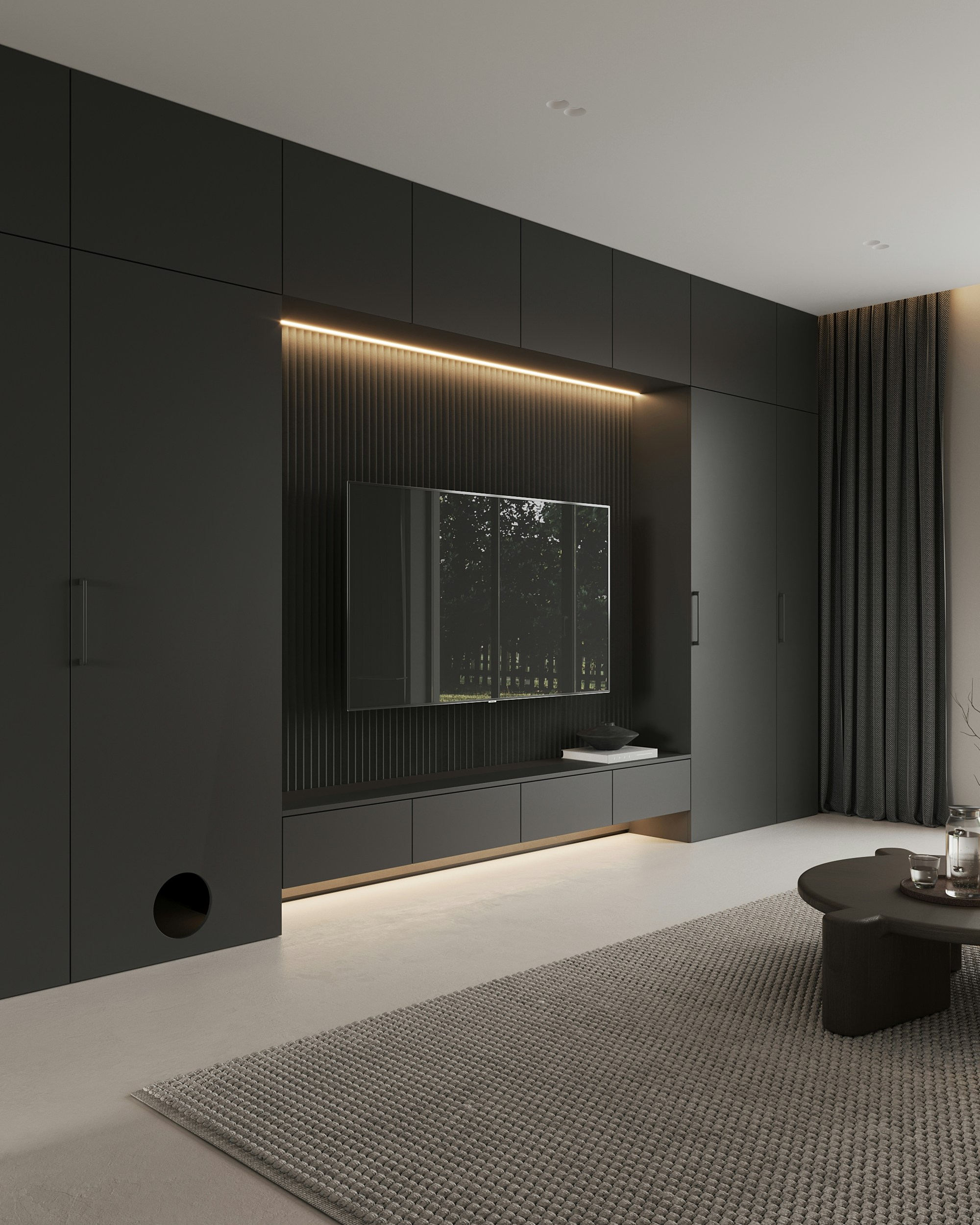 A living room with a couch, coffee table and television