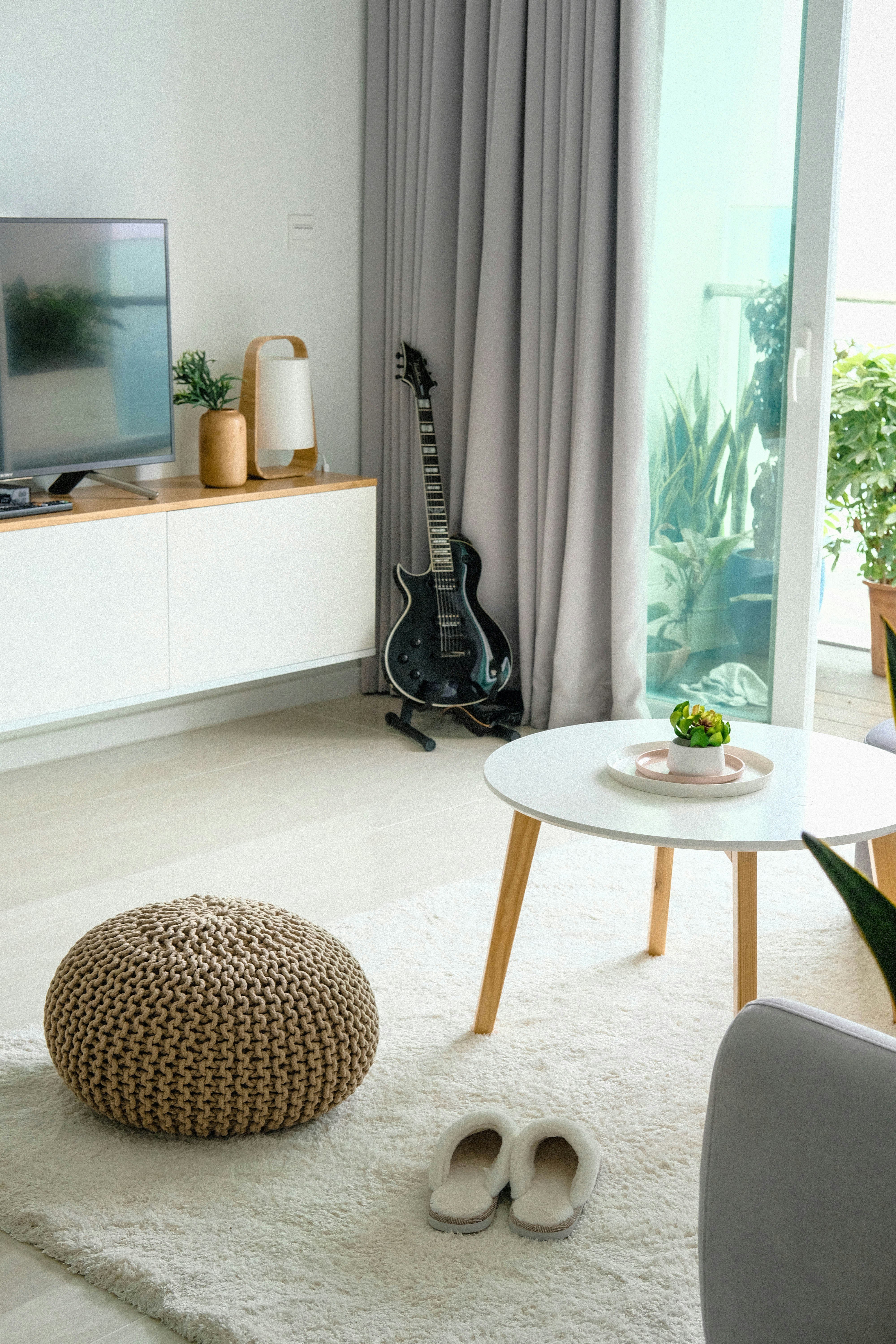 ❓ Budget TV FAQs: Your Burning Questions Answered by TV Brands black guitar beside opened door