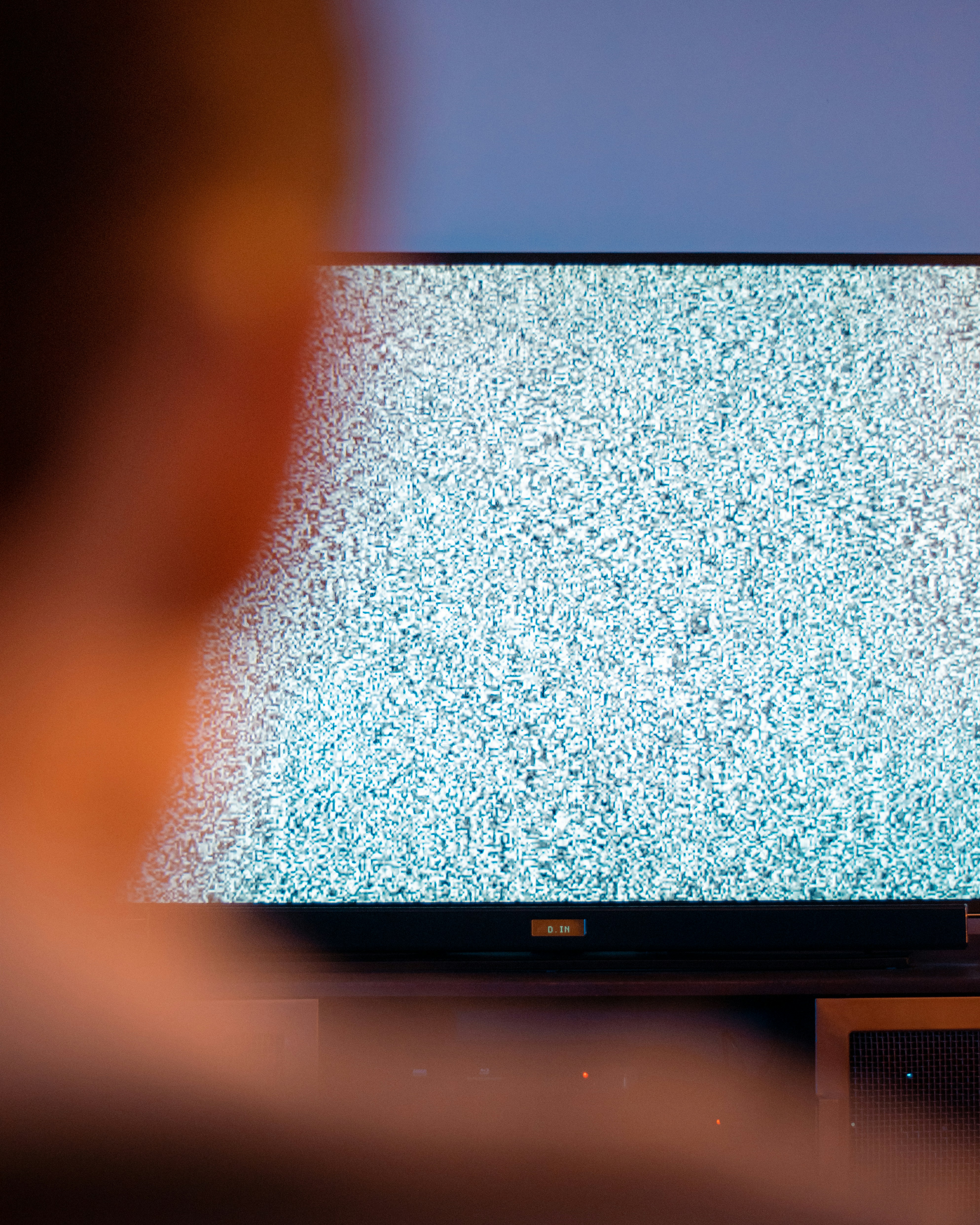 An image from a portrait shoot centred on tv static and its symbolism with consumerism... by TV Brands black flat screen tv turned on displaying white screen