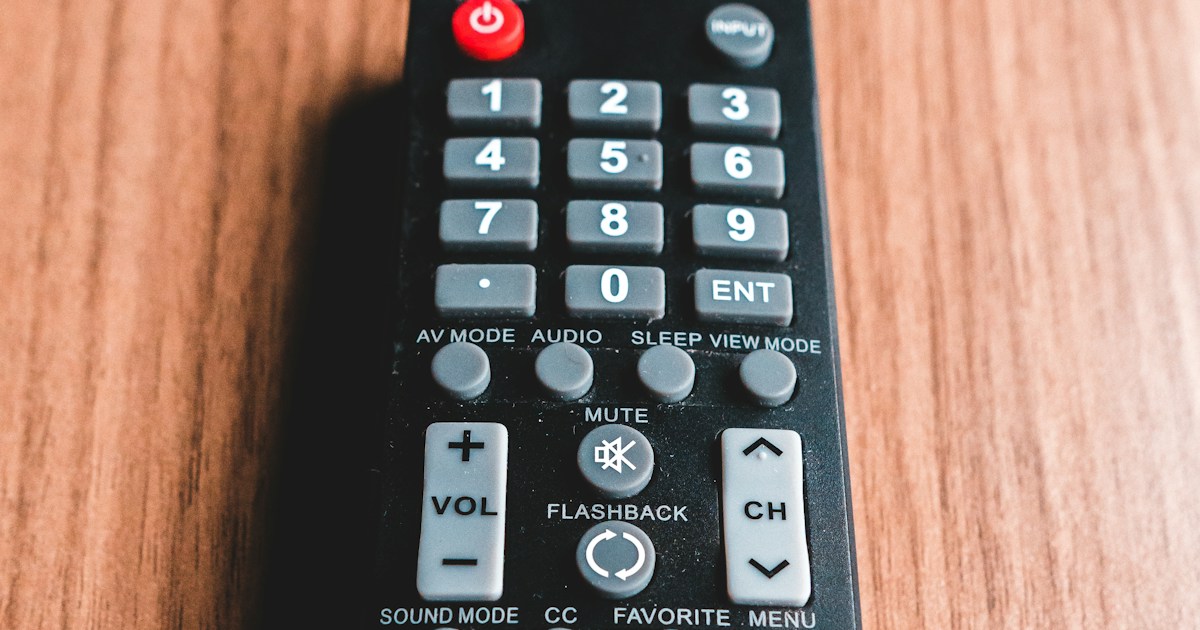 ❓ FAQ by TV Brands black remote control on brown wooden table